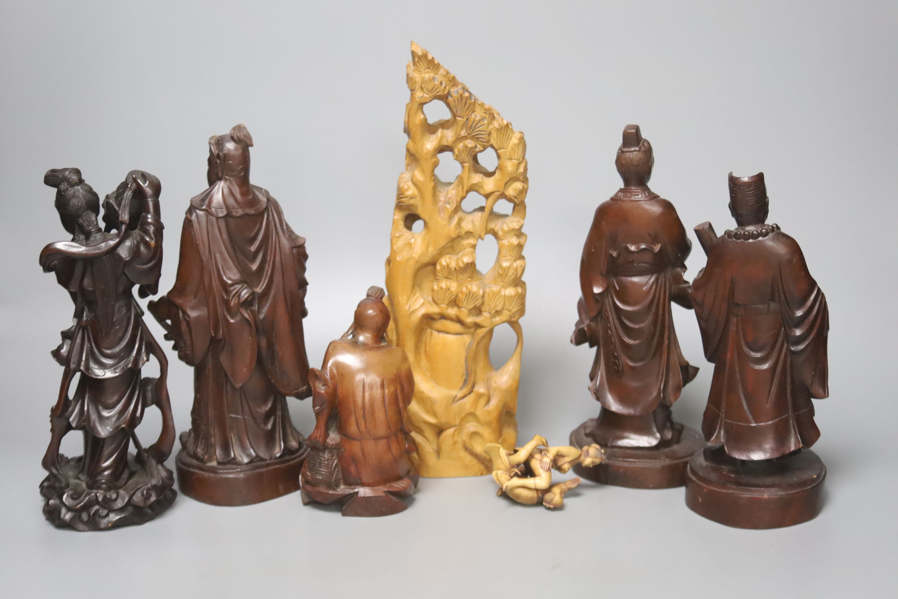A collection of Chinese and Japanese wooden carvings to include an erotic netsuke (7)